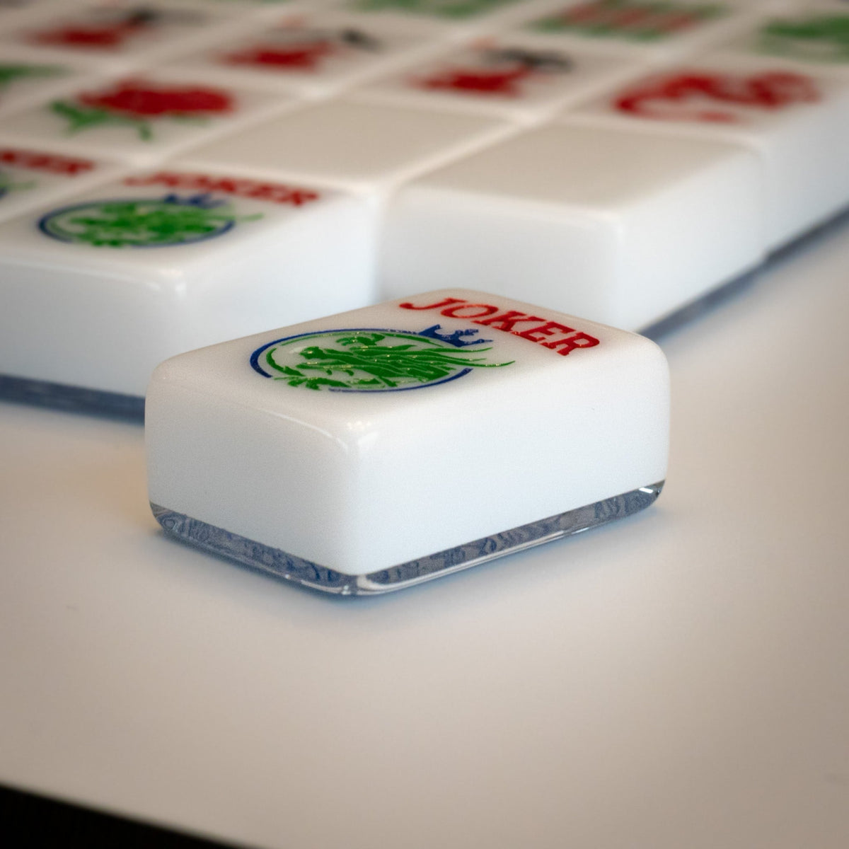 An angled shot of tiles from the Modern Classic mahjong tile line from Mahj Queen™ to show the side view of the set.